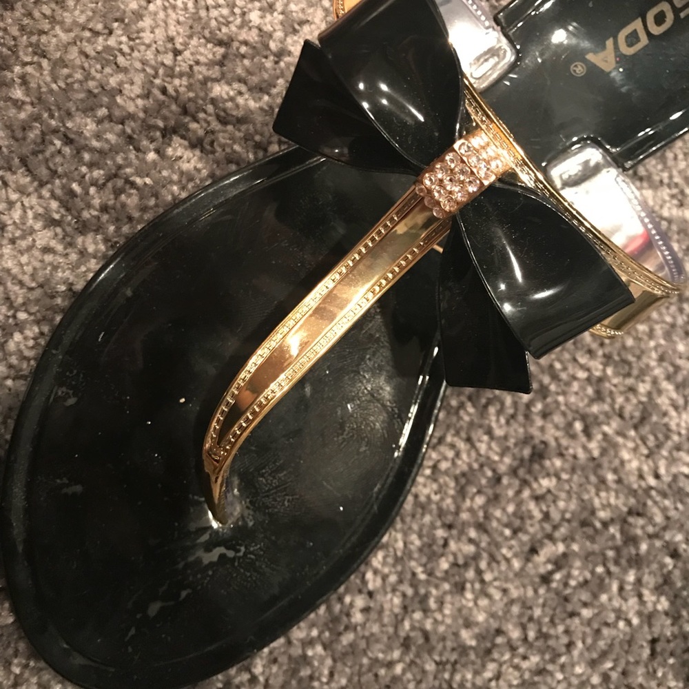 Black and gold sandals